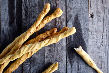 Breadsticks grissini on wood background