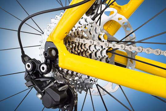 derailleur mechanism on a bicycle on bluebackground / Schaltwerk an einem Fahrrad vor blauem Hintergrund