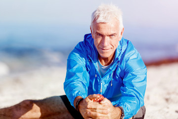 Man training on beach outside