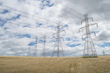 High-voltage towers on  sky background
