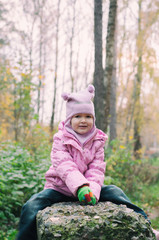 Little girl Playing in Autumn Park Leaves