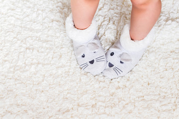 Child's feet in slippers