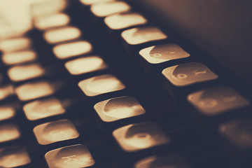 close up image of typewriter keys. vintage filtered. selective focus
