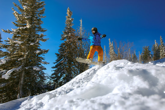 Jumping snowboarder