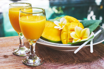 Glasses of fresh tropical smoothie or mango juice