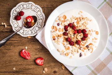 Homemade yogurt with granola and dried berries