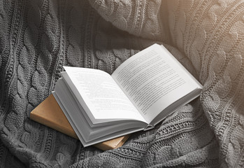 A book on knitted blanket. Peace and comfort concept