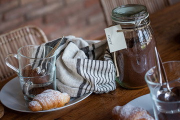 Breakfast with coffe and croissant