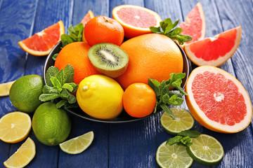 Juicy composition of tropical fruits in a bowl, close up