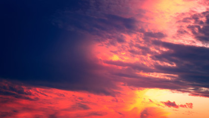 Burning red painted summer sky