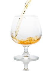 a glass of brandy on a white background.