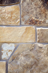 Stone Veneer Natural granite random stack rock wall closeup