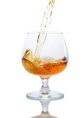 A glass of brandy on a white background.