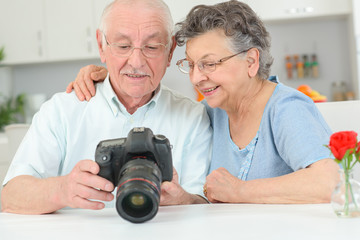 elderly couple with a high speed camera