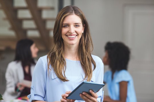 Happy Businesswoman Using Digital Tablet