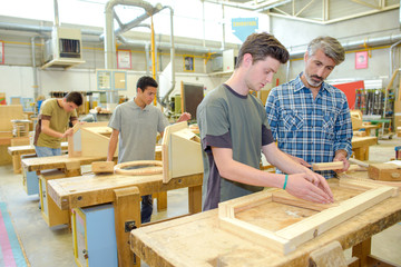 Students in a woodwork class - obrazy, fototapety, plakaty