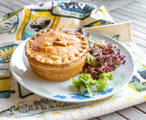 Meat pie with salad on the side