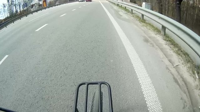 
Spring trip by bicycle  on  city road. Forward wheel
