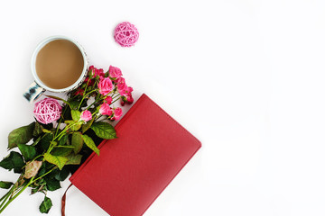 stylish roses and  coffee and notebook on white background, flat