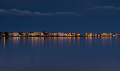 Fototapeta premium Rain-bearing clouds darken the horizon over Poole Harbour
