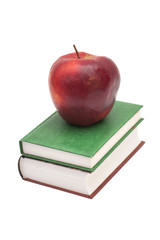 red apple on a books isolated on white