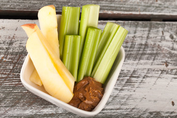 Celery and apple sticks with water