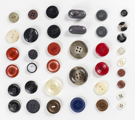 Collection of various sewing button on white background.