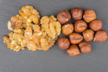 Walnuts and Forest nuts on black background