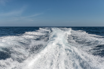 Water surface behind of fast moving motor boat 
