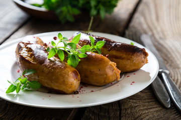 Grilled sausages with spices and herbs
