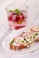  sandwich with soft cheese, radish and raspberry drink
