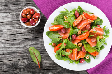 Red fish healty salad on white dish