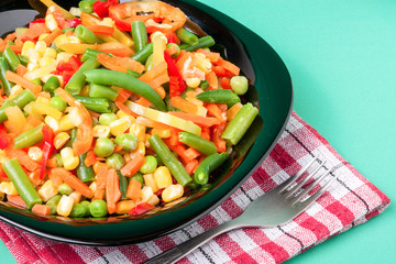 raw vegetable mix on the yellow plate