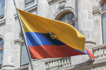 Ecuador Flag Against in Classic Building in Quito