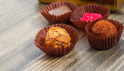  natural chocolate with cacao on wooden background