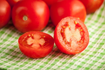 plum tomatoes on wooden rustic background