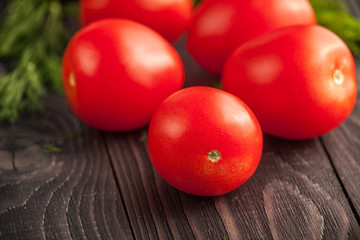 plum tomatoes on wooden rustic background