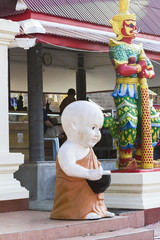 Sculpture of monk near Thai-Chinese temple, Thailand
