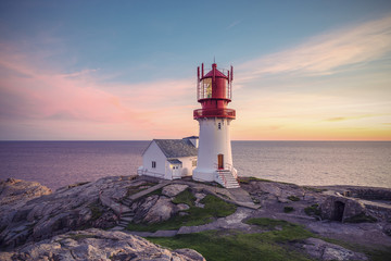 Lighthouse Lindesnes Fyr at evening on most southern point of Norway, Europe, Vintage filtered style
