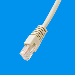 White ethernet cable on light blue background
