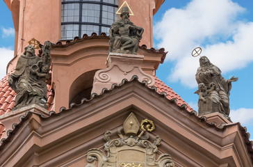 Fototapeta na wymiar a fragment of a Gothic building with statues in Prague