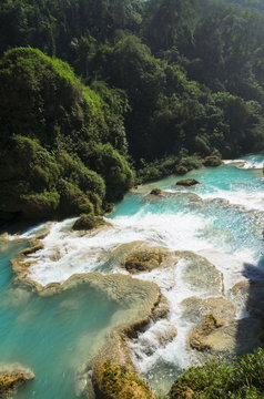 Downstream of a powerful river with turquoise pools surronded by