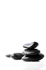 Hot spa stones on white background