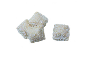 Cakes with coconut on a white background seen from above