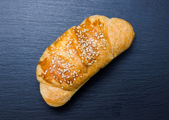 Salted croissant on a slate top seen from above