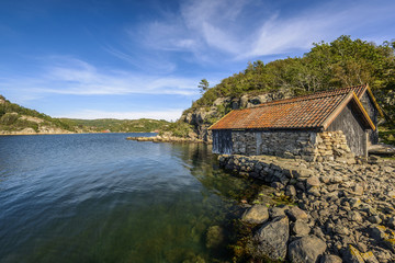 Fototapeta na wymiar scenic fjord landscape with old boathouse in the south of Norway, Europe 