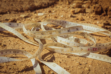 Measuring tape placed on the ground at a construction site