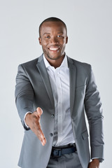 Black executive professional shaking hands in studio