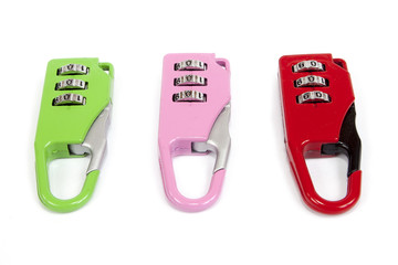 Small colorful combination locks for a bicycle or a bag, on white background