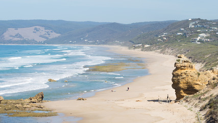 people are not recognizable on the shore